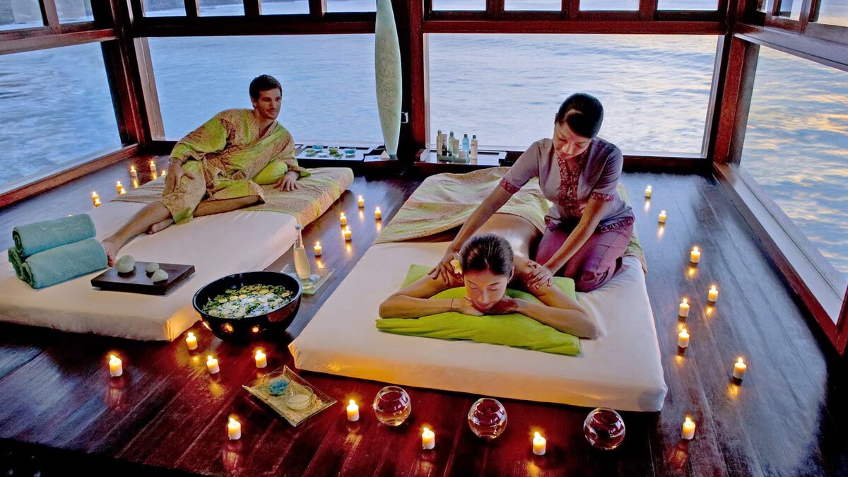 Warm towels and massage oil arranged for an evening post-flight session in a Bali hotel room